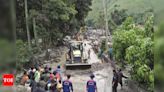 At least 12 killed, 18 missing after landslides hit Indonesia's Sulawesi island - Times of India