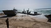 Aid deliveries suspended after rough seas damage US-built temporary pier in Gaza