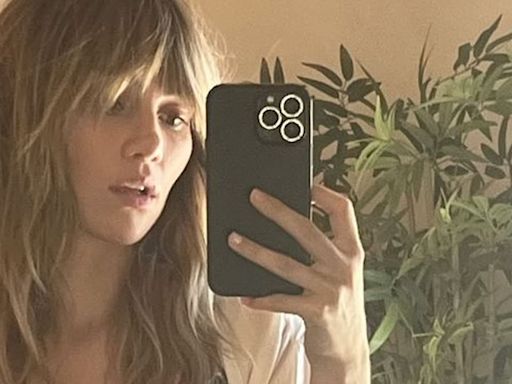 Suki Waterhouse shows off her toned bod in tiny black bikini