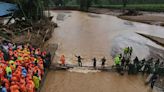 Indian soldiers building metal bridge to marooned area in Kerala landslides