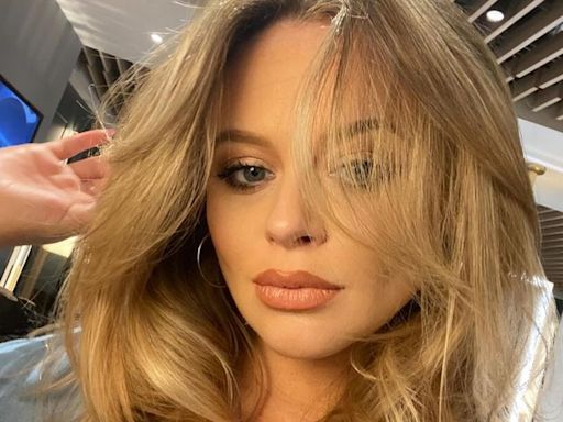 Emily Atack flaunts incredible curves in plunging swimsuit three months after giving birth