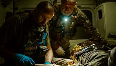 Blacked-out ambulances and bomb-cratered roads: On the night shift with Ukraine's military medics