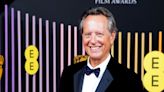 Richard E Grant runs through the Ritz hallway and asks if he will ‘ever grow up’