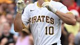 Bryan Reynolds of the Pittsburgh Pirates reacts at home plate after hitting a solo home run in the eighth inning against the Cincinnati Reds at PNC Park on Wednesday, June 19...
