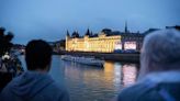 Spectators soak up Seine spectacle as rain pours on Paris