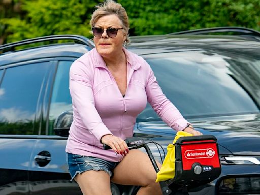 Suzy Eddie Izzard shows off toned legs in a pair of tiny denim shorts