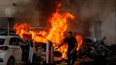 11 powerful images of the wave of surprise attacks on Israel by Palestinian militants including burning tanks and rocket barrages