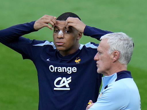 Masked Mbappé trains for Netherlands match at Euro 2024, coach optimistic he'll play