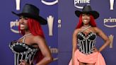 Reyna Roberts Glows in Neon Pink High-low Zavier Jones Dress With Crystallized Corset for ACM Awards 2024 Red Carpet