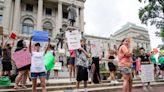 Abortion rights activists shout 'you don't care if women die' at rally outside Statehouse