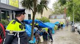 Protesters attend scene as gardaí disband migrant camp on Grand Canal