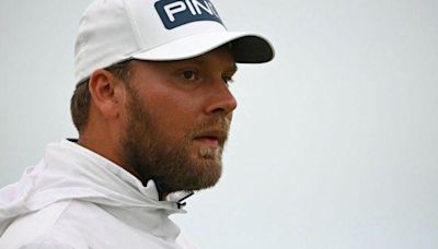 England's Brown leads Open as McIlroy toils at Troon