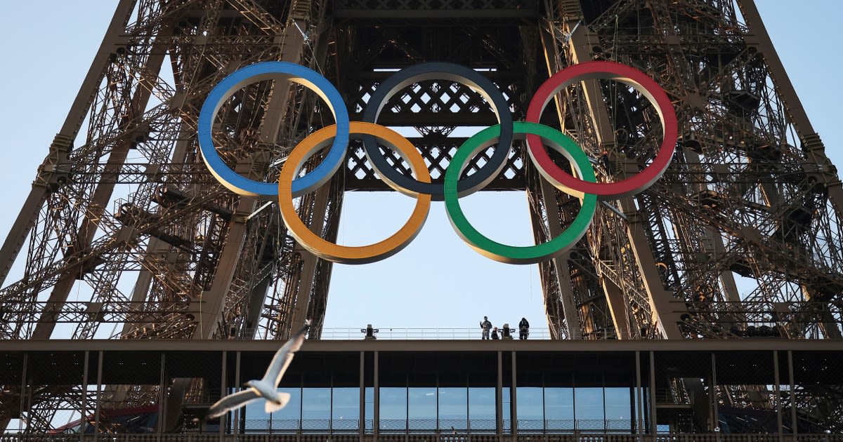 Paris Olympics organizers unveil a display of the five Olympic rings mounted on the Eiffel Tower