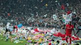 Besiktas and Antalyaspor football fans throw teddies onto pitch for earthquake victims