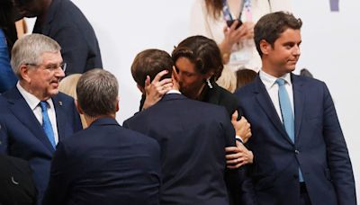 French President Emmanuel Macron’s intimate kiss with sports minister raises eyebrows