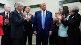 Cheers, cake and a fist-bump from GOP as Trump returns to Capitol Hill in a first since Jan. 6 riot