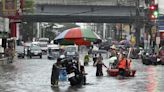 Monsoon rains worsened by offshore typhoon leave 8 dead and displace 600,000 in Philippines