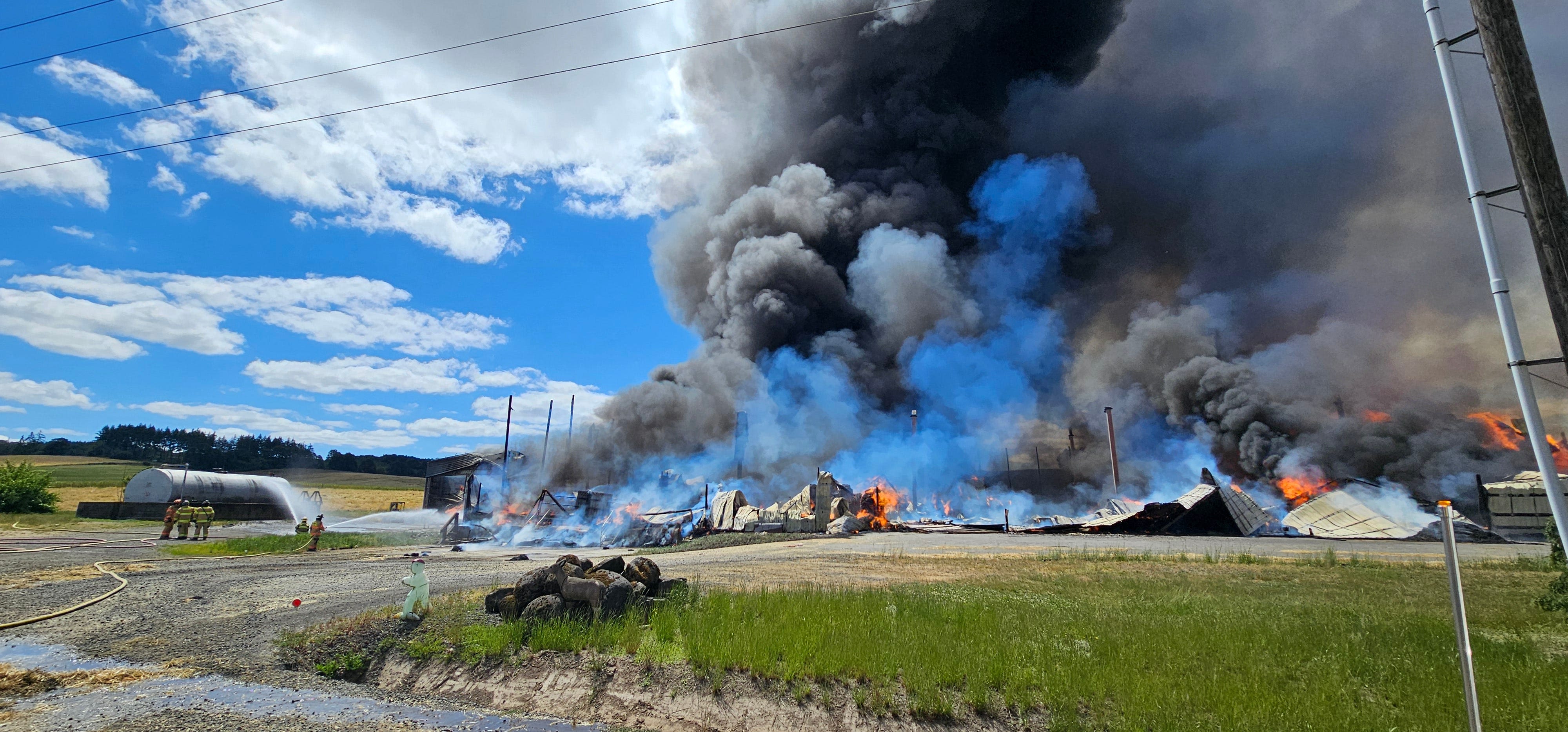 Fire at hay press in Polk County destroys facility, creates smoke cloud