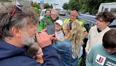 Russell Crowe smokes over heads of children while taking selfies at Irish liquor HQ launch