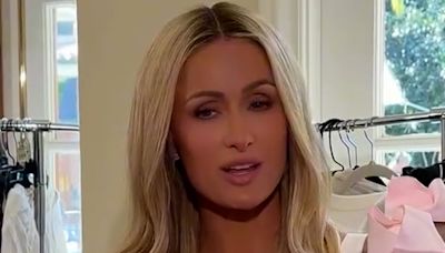 Paris Hilton holds 'so pale' daughter London and questions if babies can tan