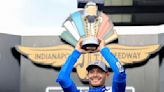 Kyle Larson kisses the bricks at Indianapolis Motor Speedway