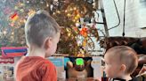 Anderson Cooper shares photo of son Wyatt helping his baby brother celebrate 1st Christmas