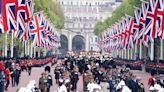 Sombre and spectacular: Thousands line streets to say farewell to the Queen on a day for the history books