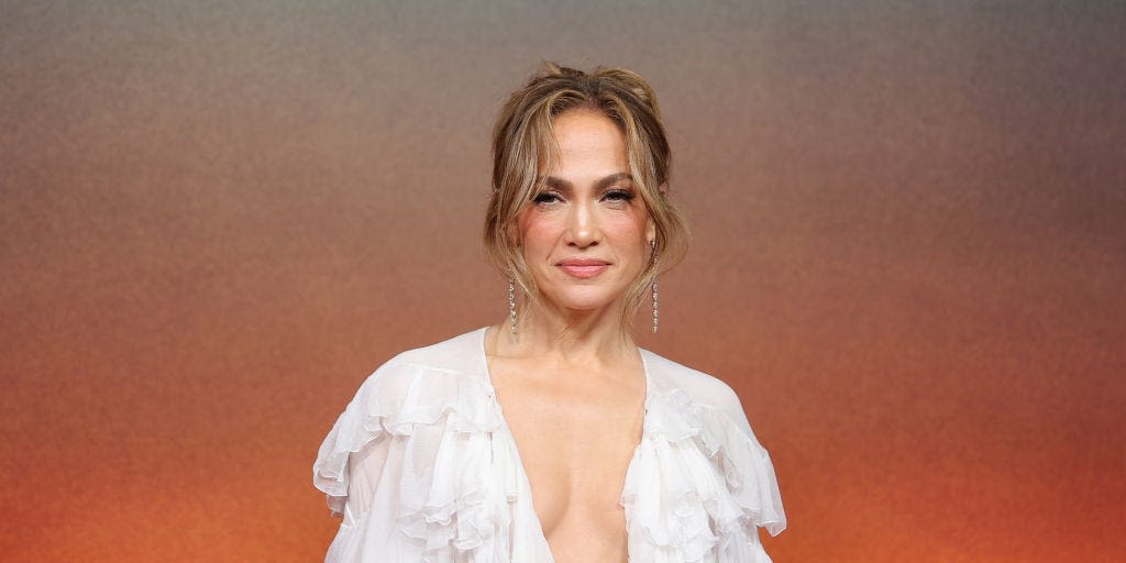 JLo wears metallic dress tied together with huge velvet bows