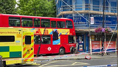 Six injured after bus crashes into scaffolding in west London