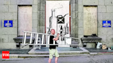 A street artist documents war in Ukraine, one stark mural at a time - Times of India