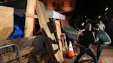 Violence flares at UCLA as police end protests at New York's Columbia