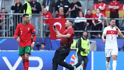 Portuguese Football Federation ask UEFA to up security after fans invade pitch for Cristiano selfie