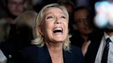French far-right leader Marine Le Pen swarmed by supporters after lead in first round of election