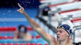 Léon Marchand sets new Olympic record, takes gold in 400-meter IM