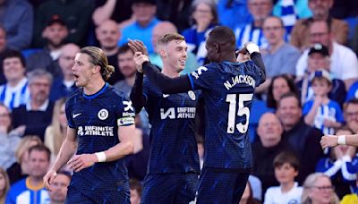 Nkunku inflates blue balloon to celebrate goal in Chelsea's 2-1 win at Brighton in Premier League