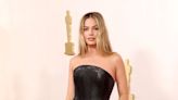 Margot Robbie Stuns in Strapless Black Versace Gown at the 2024 Oscars