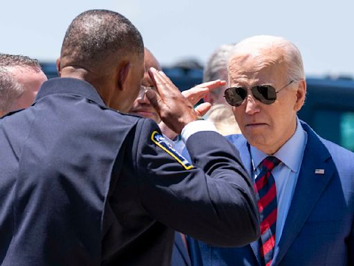 Biden, after meeting with families of officers killed in NC, says the nation is grieving with them