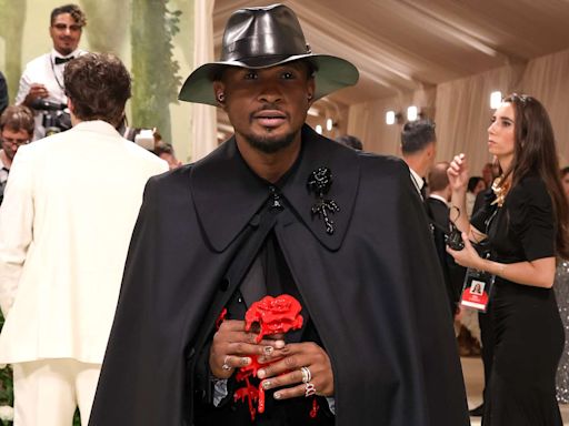 Usher Rocks All-Black 2024 Met Gala Fit — Complete with a Long Cape and Red Rose!