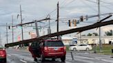 Thousands of flight cancellations and power outages as strong storms move into DC area