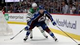 Cale Makar of the Colorado Avalanche shields the puck from Ryan Suter of the Dallas Stars during the second period in Game 4 of the Second Round of the 2024 ...