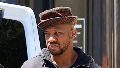 Jonathan Majors looks somber as he steps out with girlfriend Meagan Good for the first time after being sentenced in domestic violence case