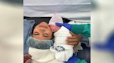 Newborn baby soothed by 1st skin contact with mom