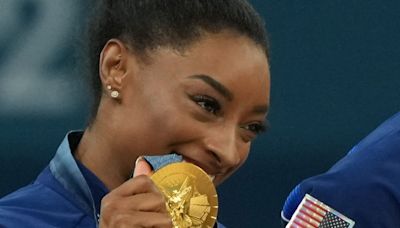 USA wins team gold as Simone Biles sets U.S. gymnastics record