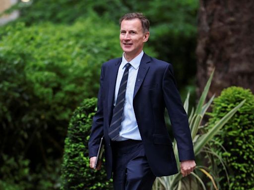 UK finance minister Hunt holds on to seat in parliament election