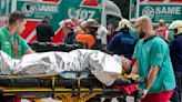 A train in central Buenos Aires strikes a boxcar on the track, injuring dozens