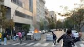 Iran faces global criticism, protests over woman's death