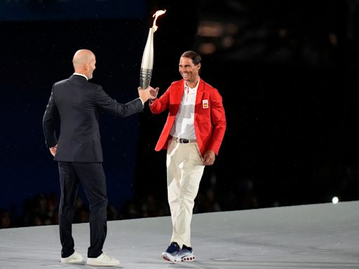 Zinedine Zidane passes torch to Rafael Nadal during star-studded Paris Olympics 2024 opening ceremony