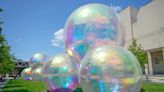 Giant, inflatable bubbles have arrived in downtown Milwaukee. Here's how to see them.