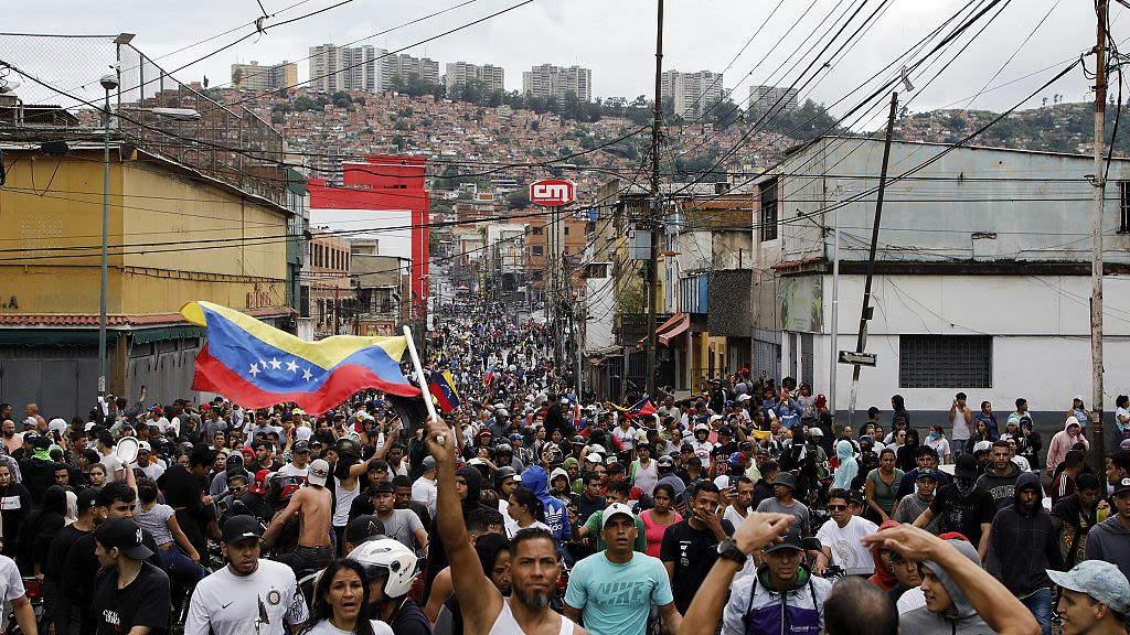 Venezuelans clash with police as disputed election is handed to President Maduro