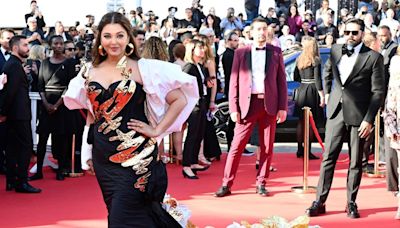 'Her outfit is better than Aishwarya': Urvashi Rautela stuns in red strapless shimmery gown; carries lip shaped mini clutch at Cannes [reactions]